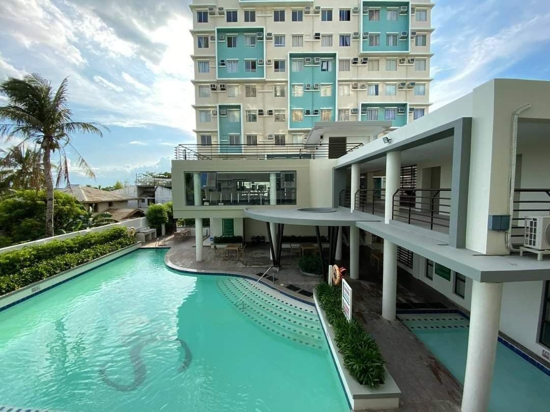 The One Spatial building beside its pool